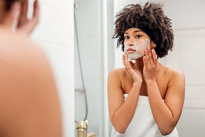 Seven Things Dermatologists Always Do to Their Faces